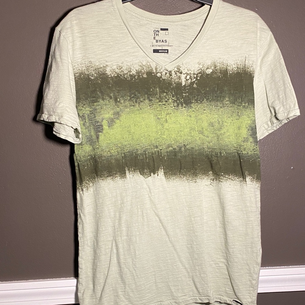 On the Byas Men's V-Neck Shirt in Green and Gray on Pale Green